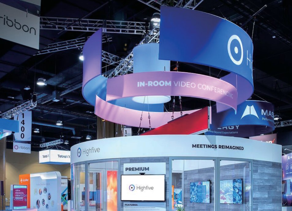 Custom circular hanging banners suspended above trade show booths