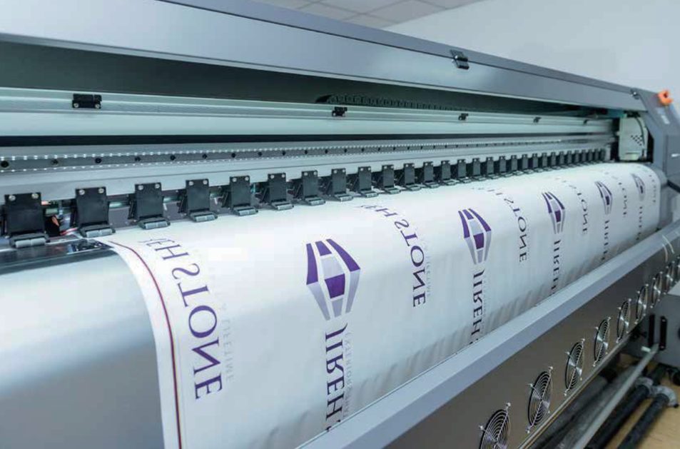 Fabric graphics coming off the large-format printer
